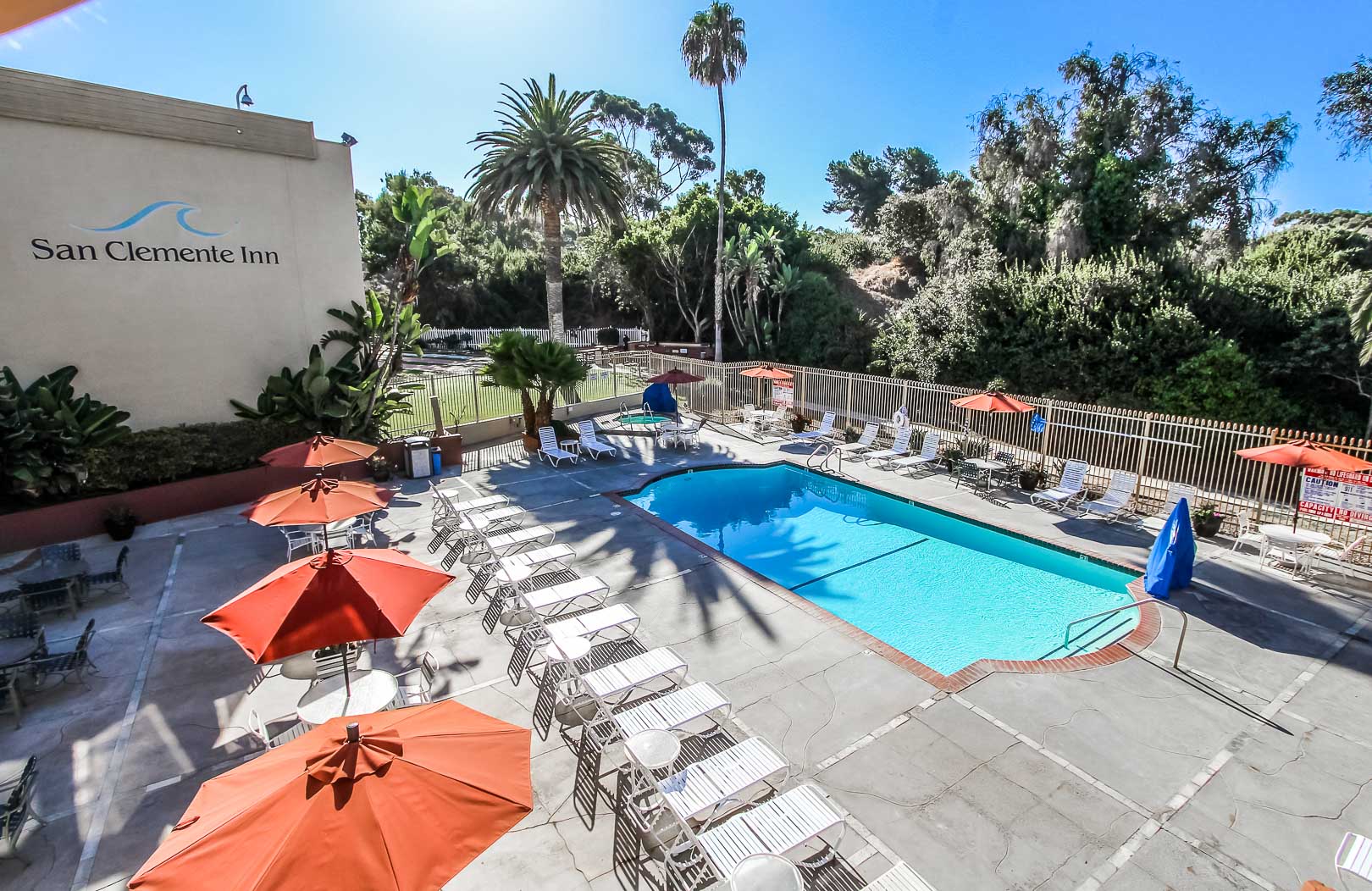 A relaxing outdoor swimming pool at VRI's San Clemente Inn in California.